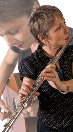 Photo of Sister Dorothy playing flute and acoustic guitar