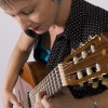 Photo of Sister Dorothy, in casual wear, with acoustic guitar