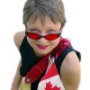 Photo of Sister Dorothy in red sunglasses, with electric guitar and Canadian flag